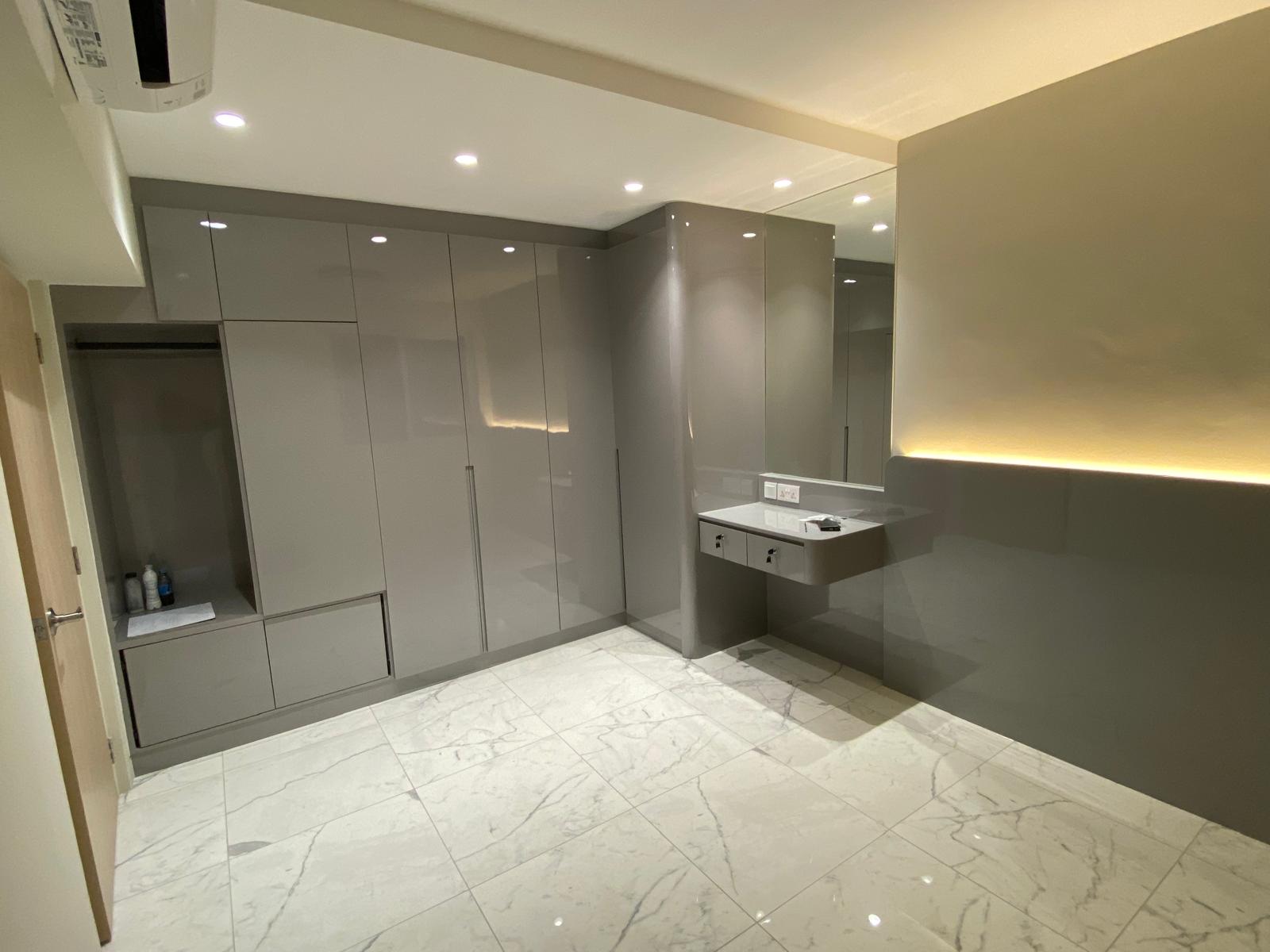 Glossy taupe wardrobe with an integrated dressing table